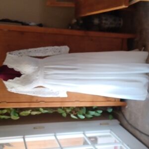 Lulu's Beautiful Floor Lenhth Backless Wedding Gown.